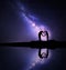 Milky Way. Man and woman holding hands in heart shape