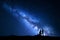 Milky Way. Night landscape with silhouettes of a couple