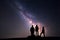 Milky Way. Night sky and silhouette of a family