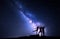 Milky Way. Night sky with silhouette of a happy family