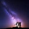 Milky Way. Night sky with silhouette of a happy family