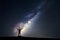 Milky Way. Night sky and silhouette of a standing man