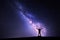 Milky Way. Night sky and silhouette of a standing man