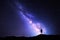 Milky Way. Night sky and silhouette of a standing man