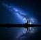 Milky Way. Night starry sky with silhouettes of a couple