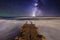 Milky Way over the pier at sea