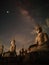 Milky Way over the sky with great of Buddha at Thailand. Noise and dust of star.  Starry in dark night.