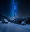 Milky way over small cottages in winter Tatra mountains, Poland