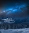 Milky way over snowy mountain in winter, Tatras Mountains, Poland