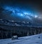 Milky way over wooden cottage in Tatra mountain in winter
