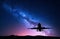 Milky Way and silhouette of a airplane