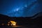 Milky Way and starry skies over a lodge in the Andes mountains. Cusco, Peru