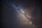 Milky Way and Starry Sky on a Clear Summer Night with a Cloud