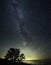 Milky way stars and Jupiter observing over sea