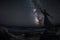 Milky way with statue of St. Francis that stretches to touch the stars - Cagliari city view of an hypothetical blackout.