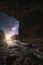 The Milky Way towering above the moonlight waterfall,Landscape of stream that flows from the cave to the waterfall with beautiful