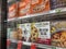Mill Creek, WA USA - circa May 2022: Angled view of a variety of frozen pizzas for sale inside the freezer section of a Town and