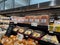 Mill Creek, WA USA - circa May 2022: Top down, angled view of a variety of cheeses for sale inside a Town and Country Market