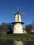 Mill in Holland with boat in front