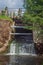 Mill waterfall under the bridge