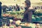 Millenial food blogger exploring local vegetable market.