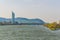 Millenium tower on the shore of Danube river with the Kahlenberg hill behind it in Vienna, Austria....IMAGE