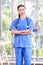 Millennial Asian young beautiful professional successful female internship nurse in blue clinical uniform with stethoscope