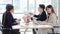 Millennial Asian young professional successful male female businessmen businesswomen employee in formal suit sitting smiling