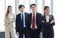 Millennial Asian young professional successful male female businessmen businesswomen in formal suit standing smiling side by side