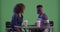 Millennial black couple have coffee on green screen