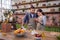 Millennial couple preparing healthy vegetarian salad laughing enjoying process and time with better half on modern cozy