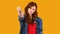 Millennial Girl Gesturing Thumbs Down Over Yellow Studio Background, Panorama