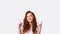 Millennial Girl Pointing Fingers Upward Posing In Studio, Panorama