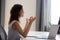 Millennial girl relaxing doing yoga with laptop focusing on medi