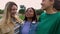 Millennial group of multi-ethnic female friends laughing together outdoors