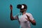 Millennial happy man wearing vr goggles with futuristic game