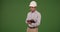 Millennial Latino architect contractor wearing hard hat. on green screen