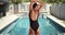 Millennial mixed race woman swimmer stretching before jumping into the pool