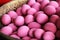 Millennial pink duck eggs in a basket in a market