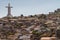 Millennium Cross between houses on hill, Coquimbo, Chile