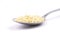 Millet flakes on spoon