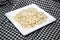 Millet grains on white dish 0027