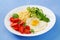 Millet porridge and tomato, cucumber salad and fried eggs.