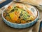 Millet quiche with smoked salmon, spinach and black olives in cooking pan
