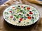 Millet quiche with spinach, black olives, cherry tomatoes and ricotta on baking paper