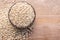 Millet rice or millet grains in wooden bowl put on wooden table