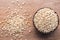 Millet rice or millet grains in wooden bowl put on wooden table