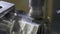 Milling machine cuts metal making part. Process of metalworking. Close-up