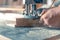 Milling wood in the joinery using manual mechanical cutters. Flying sawdust in the air