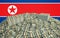 Millions of Dollars - Pile of new 100 Dollar Bills in front of the north korea flag